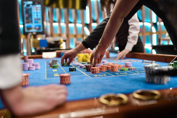 Live dealer at Shio Game table with cards and professional lighting