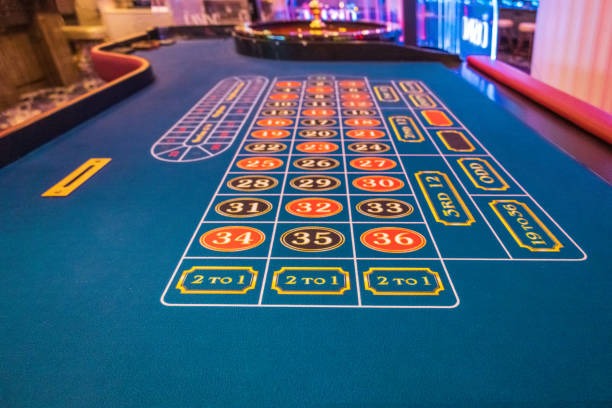 Close-up of cards being dealt in Teen Patti with dealer hands visible